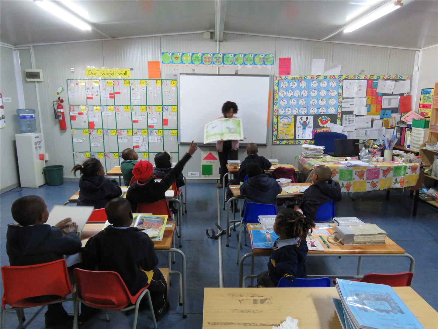 An educator and learners together in an Ithembelihle classroom