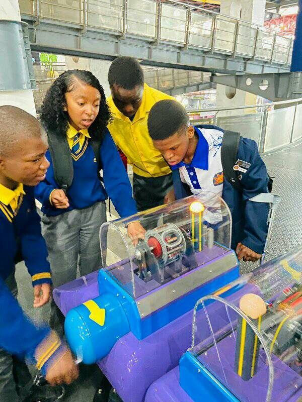 Learners exploring a science display